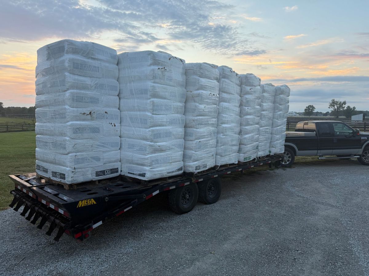 Pallets of pine shavings bedding on a flatbed trailer at a Kentucky horse farm